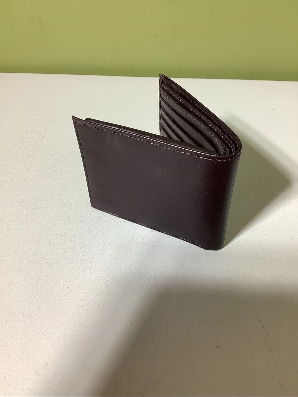 Perry Ellis brown leather bi-fold wallet